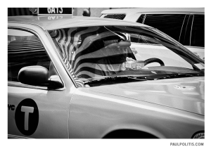 Cabbie and Flag Reflection (black and white photograph)