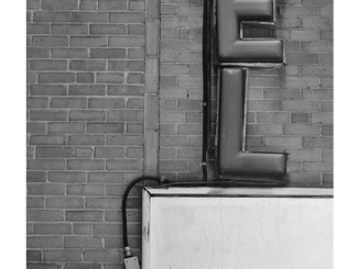 Hotel Sign Detail (black and white photograph)