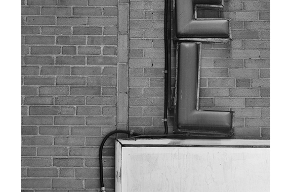 Hotel Sign Detail (black and white photograph)